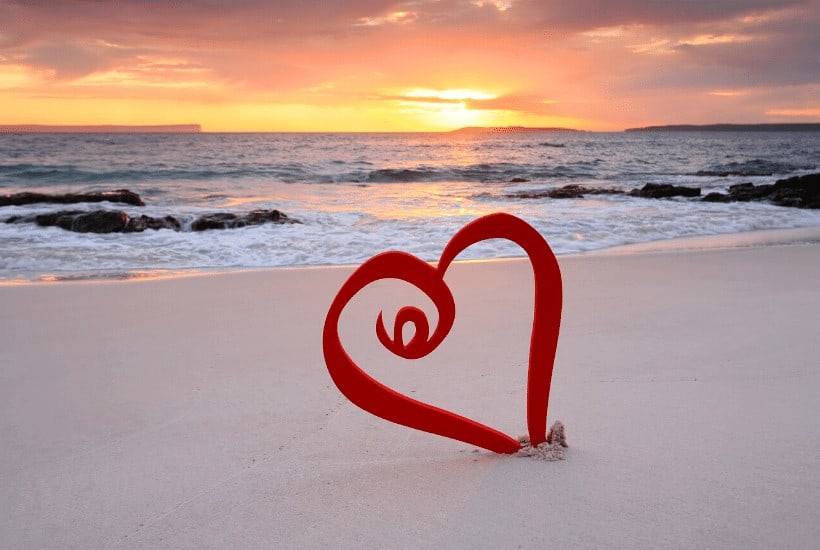 an image of a heart made in the sand featured image for What Does Loving God with All Your Heart Look Like?