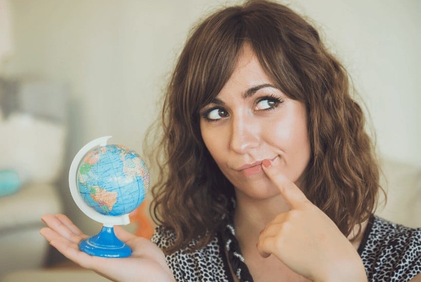 an image of a woman holding the world globe featured image for Jesus Christ Will Reign Forevermore The Great Thrilling Day