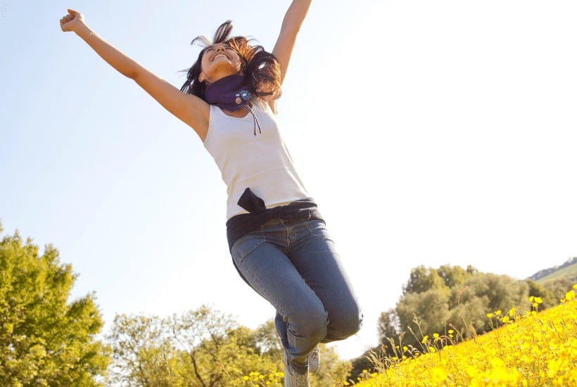 an image of a woman in a filed jumping in the air text reading 7 Tips to Living a Transparent Life for Christ