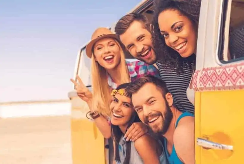 an image of a group of friends hanging out the side door of a van featured image for Godly Friendships: What Does the Bible Say About Godly Friendships?What Does the Bible Say About Godly Friendships?