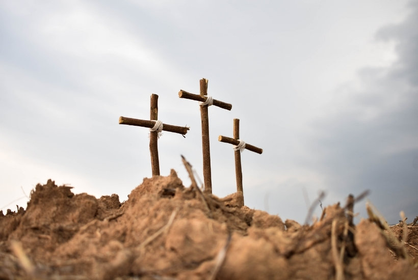 3 wooden crosses in a field featured image for What Does the Death of Jesus on the Cross Mean for You?