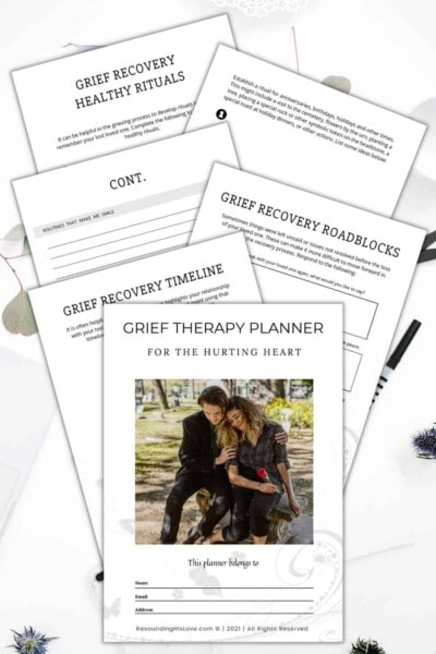 a sad couple comforting one another with text Grief Therapy Planner for the Hurting Heart